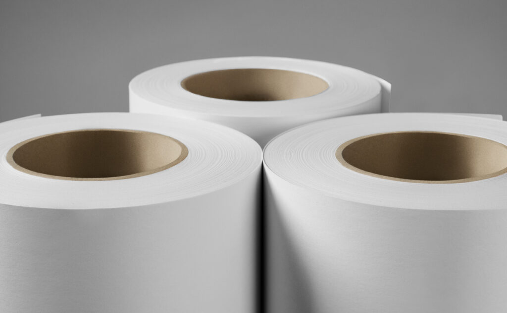 Blank white paper rolls mockup isolated on gray background. UL approved label printer